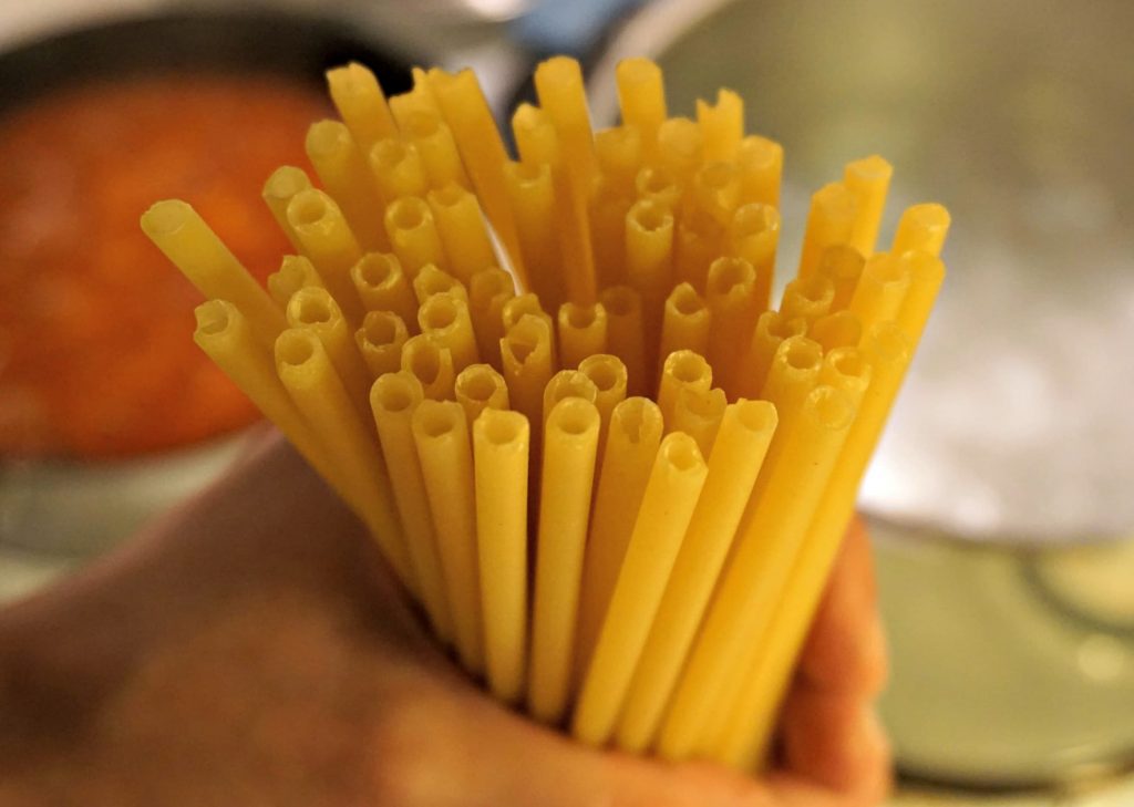 Holding a handful of Pasticcio Pasta