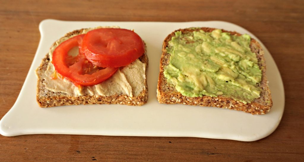 Making Avocado-Tomato-Hummus Sandwich